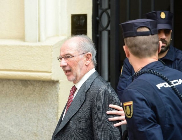 former imf head and former spanish economy minister rodrigo rato l will stand trial with 65 other former executives and board members at caja madrid and bankia photo afp
