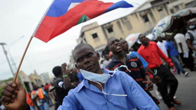hundreds of haitians protest government corruption