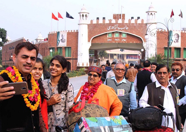 hindu pilgrims express joy on arriving in lahore through wagah crossing on foot photo app file