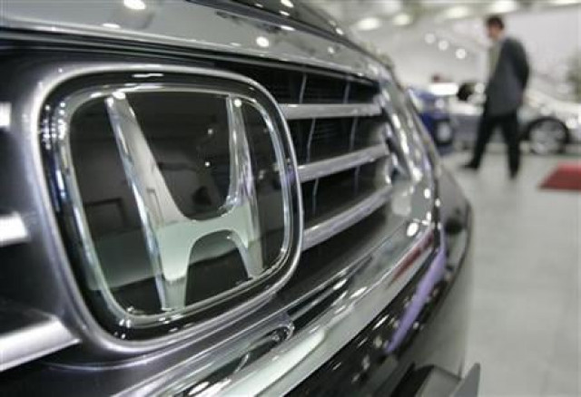 a man walks past honda motor co cars at a showroom in tokyo photo reuters a man walks past honda motor co cars at a showroom in tokyo photo reuters