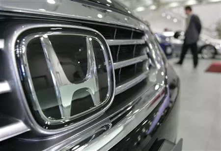 a man walks past honda motor co cars at a showroom in tokyo photo reuters a man walks past honda motor co cars at a showroom in tokyo photo reuters