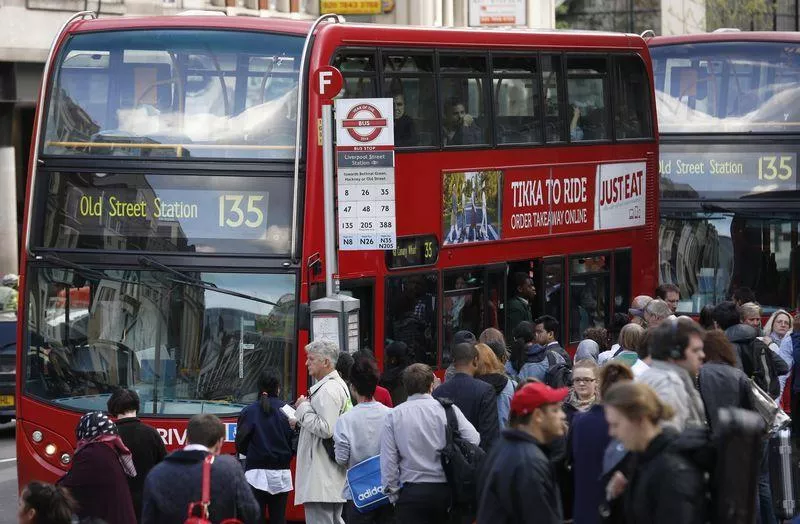 a bus waits at a bus stop during rush hour outside liverpool street station in london photo reuters a bus waits at a bus stop during rush hour outside liverpool street station in london photo reuters