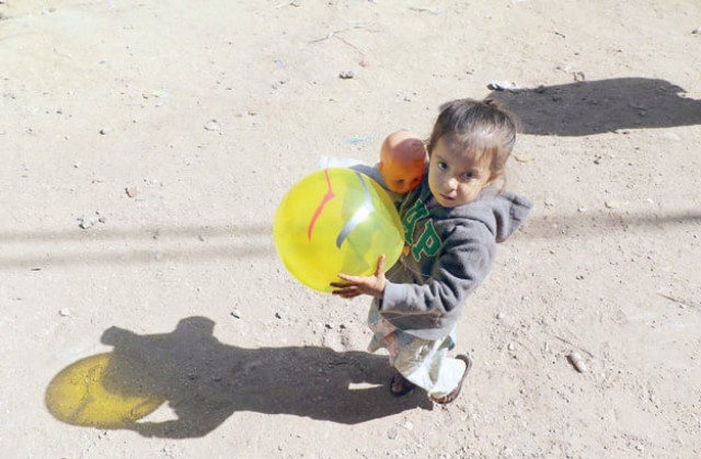 playing around a young girl clutches a ball and doll in her arms in karachi on universal children s day the theme of this year s day is stop violence against children corporal punishment is a norm in pakistan and many children are subjected to all kinds of violence at the hands of their families or employers in the case of those who come from low income households photo online playing around a young girl clutches a ball and doll in her arms in karachi on universal children s day the theme of this year s day is stop violence against children corporal punishment is a norm in pakistan and many children are subjected to all kinds of violence at the hands of their families or employers in the case of those who come from low income households photo online