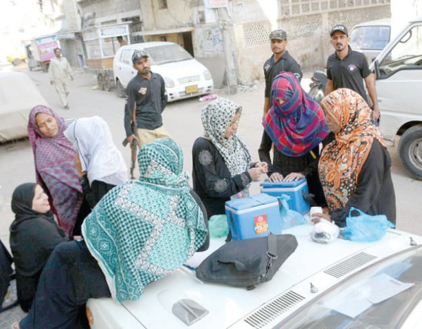 fighting a virus a team of volunteers prepares to administer polio drops to children under five years of age in khudad colony on the first day of the campaign photo rashid ajmeri express fighting a virus a team of volunteers prepares to administer polio drops to children under five years of age in khudad colony on the first day of the campaign photo rashid ajmeri express