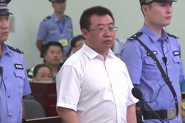 this handout file video frame grab taken and released by changsha intermediate people 039 s court on august 22 2017 shows chinese rights lawyer jiang tianyong c appearing in court in changsha in china 039 s central hunan province photo afp