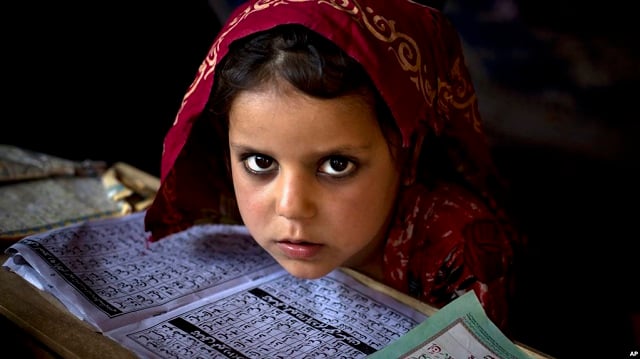 an internally displaced pakistani girl from a tribal area attends her daily lesson at a madrassa a school for the study of islam on the outskirts of islamabad pakistan monday april 6 2015 photo voa