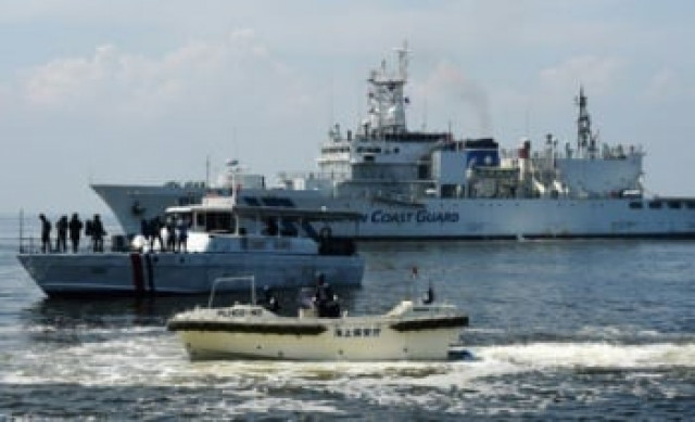 japanese rescuers found the bodies of two fishermen from a sunken boat that capsized a day earlier though seven others still missing photo afp japanese rescuers found the bodies of two fishermen from a sunken boat that capsized a day earlier though seven others still missing photo afp