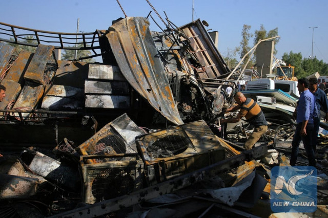 people gather at the site where a suicide truck bomb hit a crowded security checkpoint in northern hilla city iraq on march 6 2016 photo xinhua people gather at the site where a suicide truck bomb hit a crowded security checkpoint in northern hilla city iraq on march 6 2016 photo xinhua