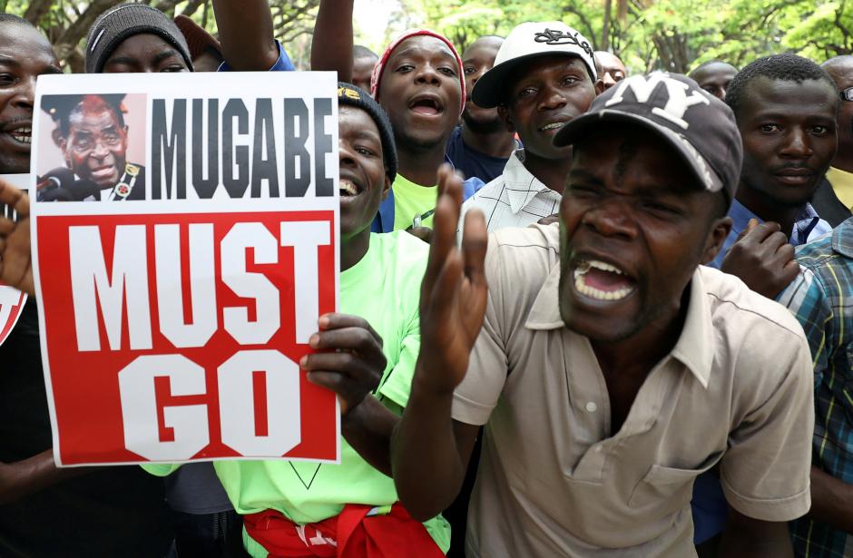 protesters call for zimbabwean president robert mugabe to resign across the road from parliament in harare zimbabwe photo reuters