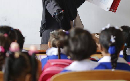 a teacher gives lesson to schoolgirls in a classroom photo reuters