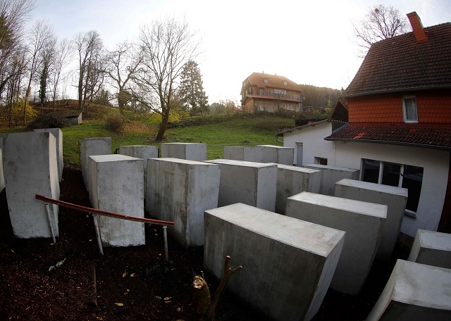 a pared down version of berlin 039 s holocaust memorial built by a german political art group is seen next to the home background of bjoern hoecke a senior member of the anti immigrant alternative for germany afd in the village of bornhagen germany november 22 2017 photo reuters