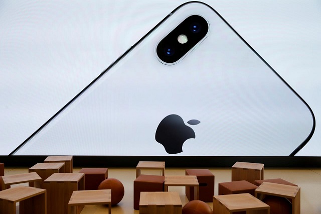 an iphone x is seen on a large video screen in the new apple visitor center in cupertino california us november 17 2017 photo reuters