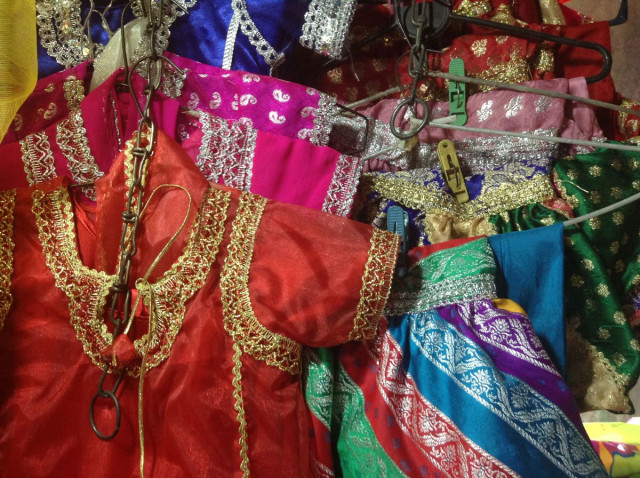 file photo children garments prepared by female tailors of the bazaar photo ayesha mir express