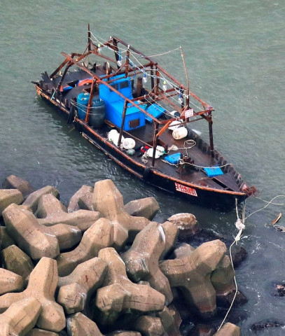 a wooden boat which according to a police official carried eight men who said they were from north korea and appear to be fishermen whose vessel ran into trouble is seen near a breakwater in yurihonjo akita prefecture japan november 24 2017 photo via reuters a wooden boat which according to a police official carried eight men who said they were from north korea and appear to be fishermen whose vessel ran into trouble is seen near a breakwater in yurihonjo akita prefecture japan november 24 2017 photo via reuters