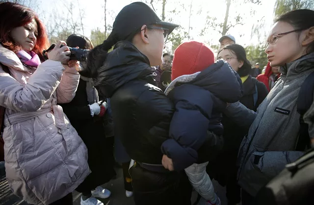 a parent is surrounded by members of the media outside the kindergarten run by pre school operator ryb education inc being investigated by china 039 s police in beijing china november 24 2017 photo reuters a parent is surrounded by members of the media outside the kindergarten run by pre school operator ryb education inc being investigated by china 039 s police in beijing china november 24 2017 photo reuters