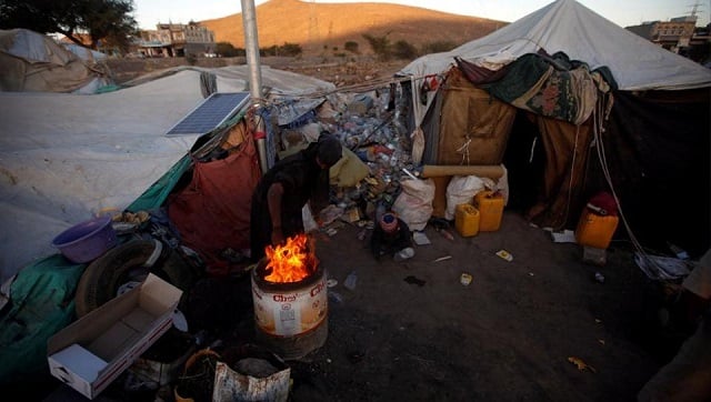 a displaced yemeni woman ligths a fire in a makeshift camp near sanaa yemen november 17 2017 photo reuters