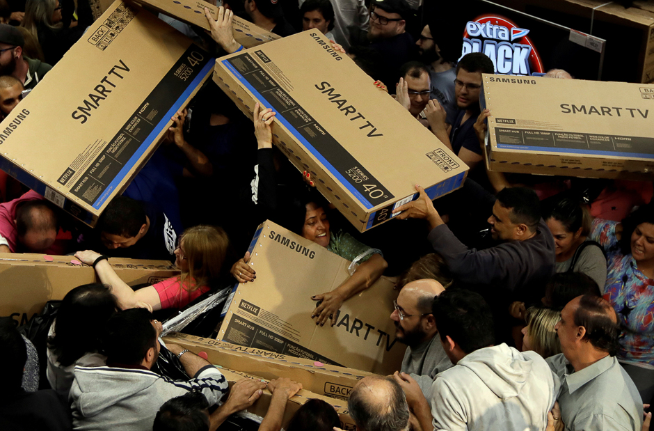 shoppers reach out for television sets as they compete to purchase retail items on black friday at a store in sao paulo brazil photo reuters