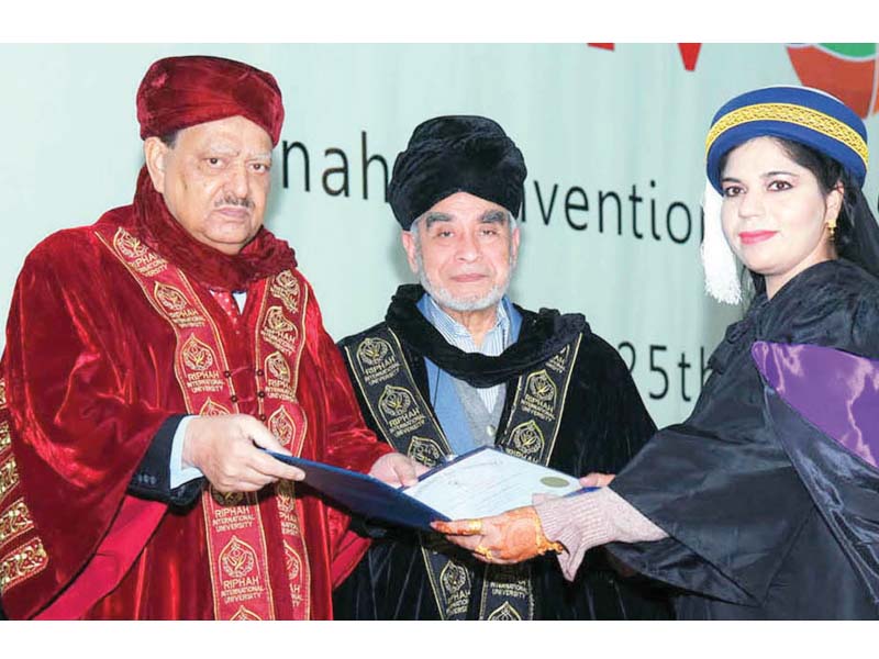 president awarding a certificate and a gold medal to a top position holder on the 12th convocation of riphah international university photo inp