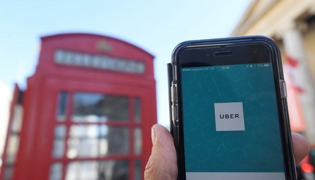 a photo illustration shows the uber app logo displayed on a mobile telephone as it is held up for a posed photograph in central london september 22 2017 photo reuters