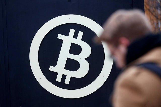 a bitcoin sign is seen during riga comm 2017 a business technology and innovation fair in riga latvia november 9 2017 photo reuters a bitcoin sign is seen during riga comm 2017 a business technology and innovation fair in riga latvia november 9 2017 photo reuters