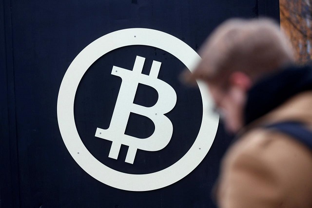 a bitcoin sign is seen during riga comm 2017 a business technology and innovation fair in riga latvia november 9 2017 photo reuters