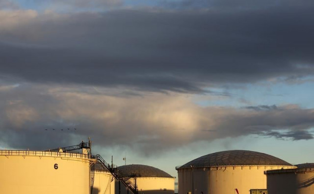crude oil storage tanks are seen at the kinder morgan terminal in sherwood park near edmonton alberta canada photo reuters crude oil storage tanks are seen at the kinder morgan terminal in sherwood park near edmonton alberta canada photo reuters