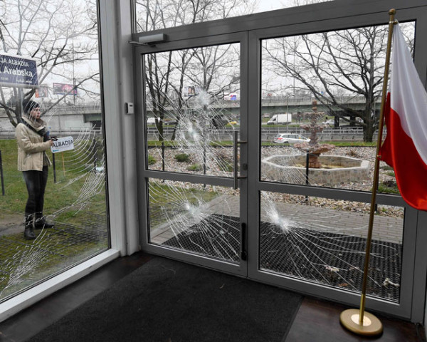 a policeman securing evidences is seen behind shattered glass of the muslim cultural centre in warsaw on november 27 2017 after it was vandalised photo afp a policeman securing evidences is seen behind shattered glass of the muslim cultural centre in warsaw on november 27 2017 after it was vandalised photo afp