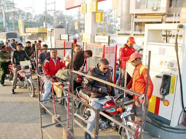 motorcyclists line up at a petrol station photo abid nawaz express motorcyclists line up at a petrol station photo abid nawaz express