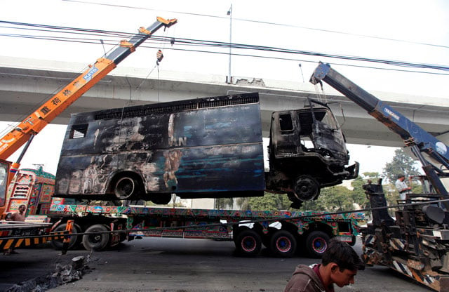 a police prison van destroyed during clashes is cleared from the road a day after the tehreek e labaik called off nationwide protests in islamabad november 28 2017 photo reuters a police prison van destroyed during clashes is cleared from the road a day after the tehreek e labaik called off nationwide protests in islamabad november 28 2017 photo reuters