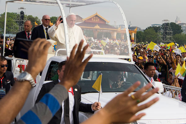 pope francis waves to the catholics in yangon on tuesday photo afp