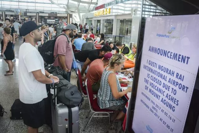 ourists wait at ngurah rai international airport in denpasar bali photo afp ourists wait at ngurah rai international airport in denpasar bali photo afp