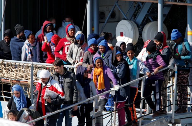 migrants wait to disembark from german vessel fgs rhein in the sicilian harbour of catania italy photo reuters