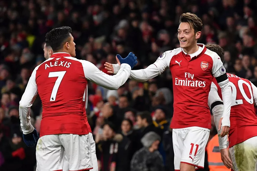 arsenal 039 s german midfielder mesut ozil r celebrates scoring their fourth goal during the english premier league football match between arsenal and huddersfield town at the emirates stadium in london on november 29 2017 photo afp arsenal 039 s german midfielder mesut ozil r celebrates scoring their fourth goal during the english premier league football match between arsenal and huddersfield town at the emirates stadium in london on november 29 2017 photo afp