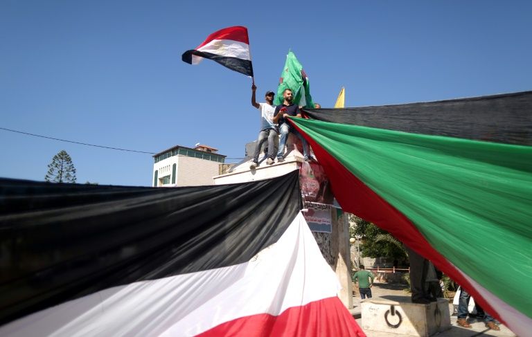 palestinians celebrate after the landamark reconciliation agreement between hamas and fatah was reached photo afp