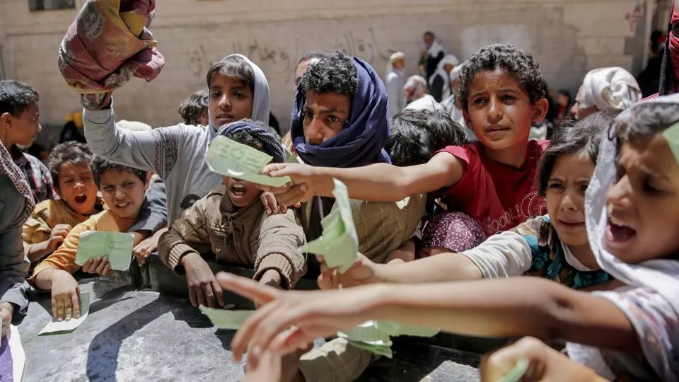 yemenis present documents in order to receive food rations provided by a local charity in sanaa photo afp yemenis present documents in order to receive food rations provided by a local charity in sanaa photo afp