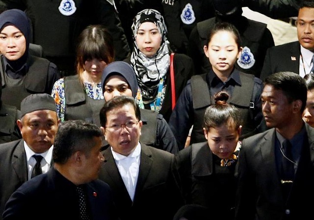 indonesian siti aisyah and vietnamese doan thi huong who are on trial for the killing of kim jong nam the estranged half brother of north korea 039 s leader are escorted as they revisit the kuala lumpur international airport 2 in sepang malaysia october 24 2017 photo reuters
