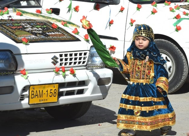 a girl takes part in a rally during celebrations marking eid e milad un nabi photo afp
