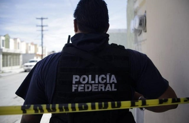 file photo a federal police officer stands behind a police tape near a crime scene in apodaca on the outskirts of monterrey february 26 2012 photo reuters file photo a federal police officer stands behind a police tape near a crime scene in apodaca on the outskirts of monterrey february 26 2012 photo reuters