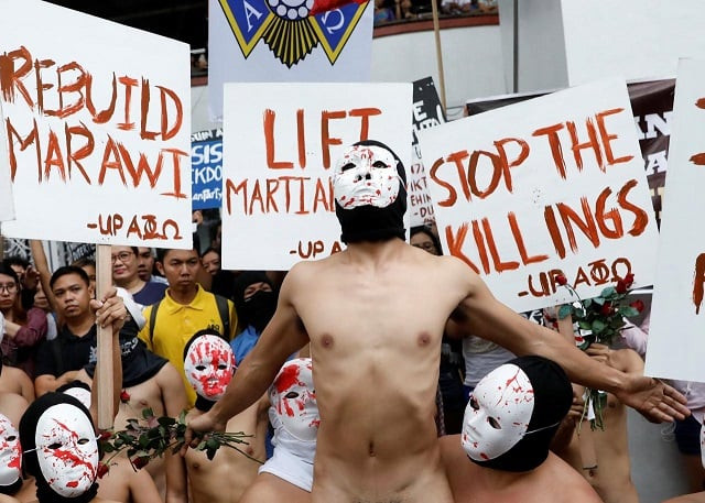 naked mebers of the alpha phi omega apo fraternity wearing masks attend a protest against extrajudicial killings and the lifting of martial law in the southern island of mindanao at the university of the philippines in quezon city metro manila philippines december 1 2017 photo reuters naked mebers of the alpha phi omega apo fraternity wearing masks attend a protest against extrajudicial killings and the lifting of martial law in the southern island of mindanao at the university of the philippines in quezon city metro manila philippines december 1 2017 photo reuters
