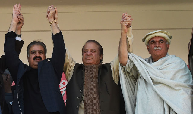 former prime minister nawaz sharif joins hands in solidarity with balochistan chief minister sanaullah zehri and pakhtunkhwa milli awami chief mehmood achakzai at a public rally in quetta on november 2 2017 photo afp