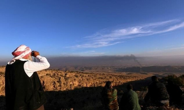 a yazidi man watches on as kurdish forces battle to end the islamic state group 039 s brutal rule over the iraqi town of sinjar photo afp a yazidi man watches on as kurdish forces battle to end the islamic state group 039 s brutal rule over the iraqi town of sinjar photo afp