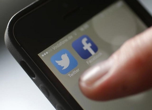 an illustration picture shows a man starting his twitter app on a mobile device in hanau near frankfurt october 21 2013 photo reuters an illustration picture shows a man starting his twitter app on a mobile device in hanau near frankfurt october 21 2013 photo reuters