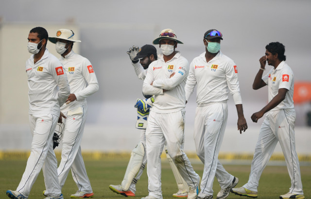 upstaged kohli cracked a career best 243 but his feat was overshadowed on the second day after sri lanka complained about air pollution in the indian capital halting play three times photo afp upstaged kohli cracked a career best 243 but his feat was overshadowed on the second day after sri lanka complained about air pollution in the indian capital halting play three times photo afp