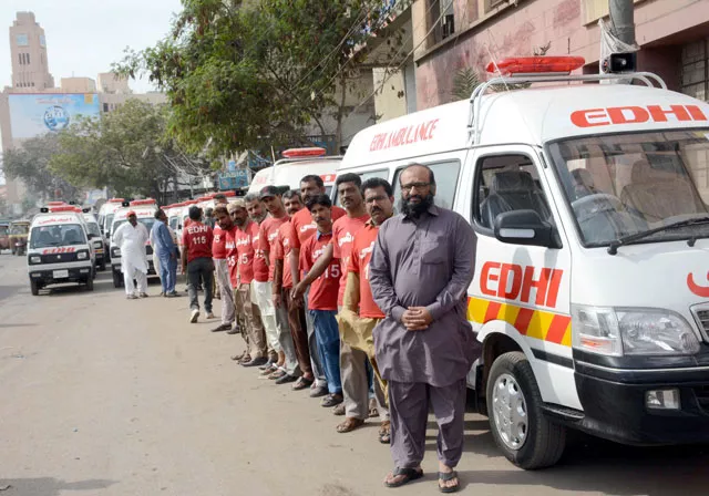 edhi foundation head faisal edhi stands with crew of the newly inducted ambulances photo rashid ajmeri express edhi foundation head faisal edhi stands with crew of the newly inducted ambulances photo rashid ajmeri express