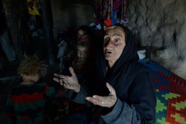 widowed afghan afghan grandmother janat bibi has no adult males left in her family after the taliban killed her son and two grandsons during an attack on their police base a few months ago now she battles to care for 12 children photo afp