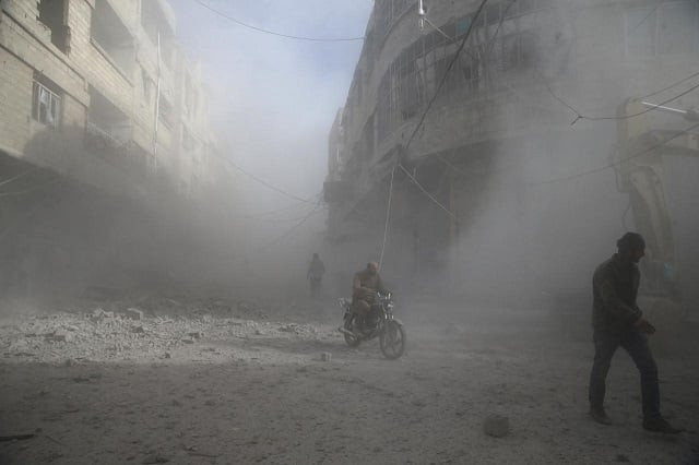 people are seen during shelling in the town of hamoria eastern ghouta in damascus syria december 3 2017 photo reuters people are seen during shelling in the town of hamoria eastern ghouta in damascus syria december 3 2017 photo reuters