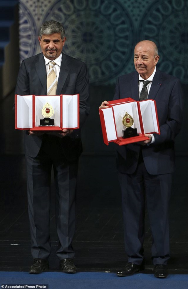 turkish french sami erol gelenbe right and iranian mohammad amin shokrollahi two computer science experts show their awards during the biennial 500 000 mustafa prize ceremony at vahdat hall in tehran iran sunday dec 3 2017 photo ap