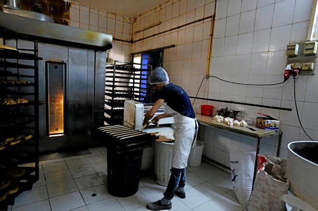 a baker prepares a tray of baguettes at a bakery in tunis tunisia december 1 2017 picture taken december 1 2017 photo reuters