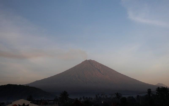 reuters staff 3 min read shanghai reuters   china s aviation authority has suspended all flights from the indonesian holiday island of bali to chinese cities until the threat of volcanic ash clears the state run people s daily newspaper reported on monday mount agung volcano is seen from amed in karangasem regency bali indonesia december 4 2017 photo reuters