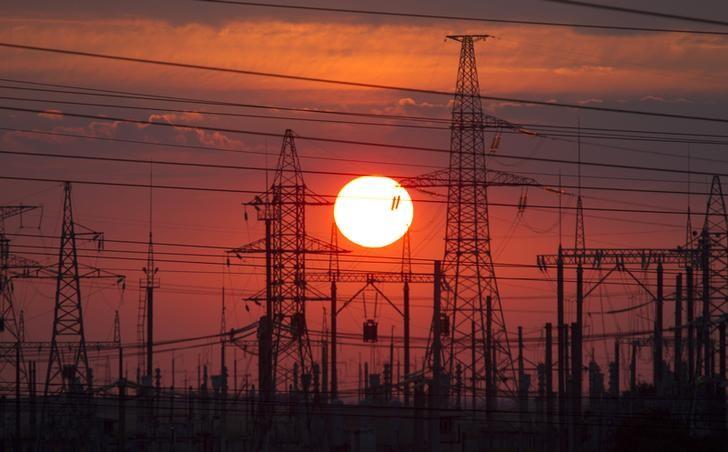 electric pylons are seen after sunset photo reuters